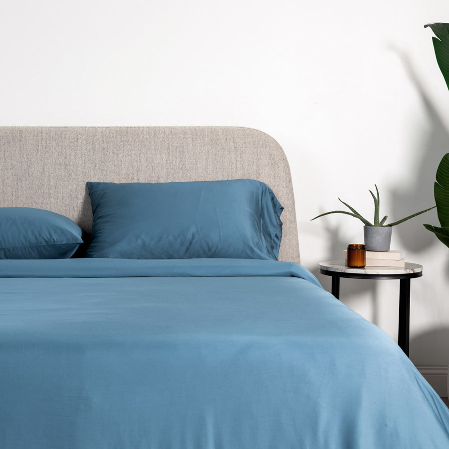 Fitted bamboo sheet secured around a deep mattress