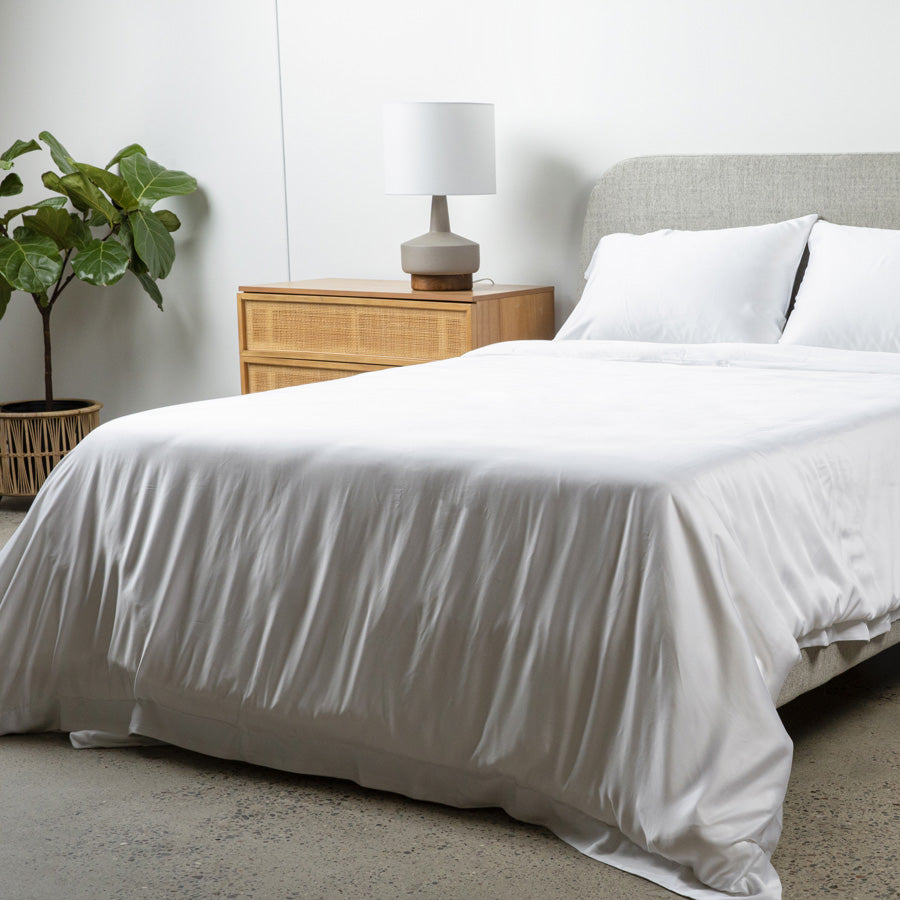 White Eden & Om bamboo sheets on a serene bed